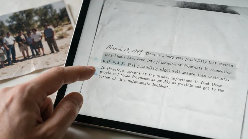 A hand highlighting selectable text on a tablet screen, showing the searchable-text advantage that matters in the jpeg vs pdf decision.